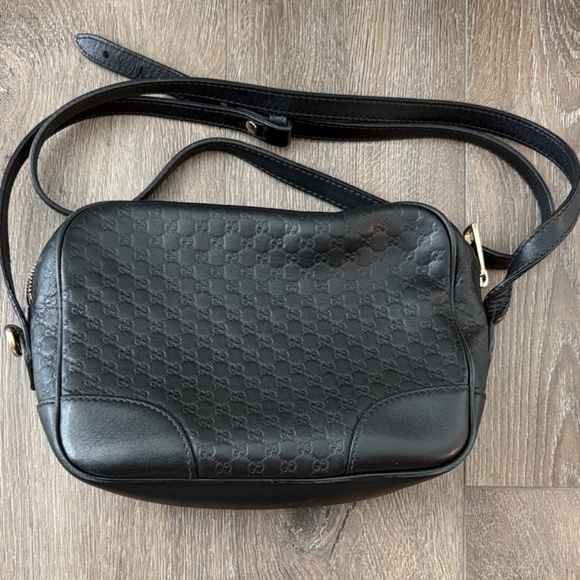 Gucci Handbags - Gucci embossed black leather camera bag.